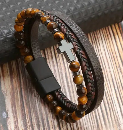 Armbånd med kors og steiner